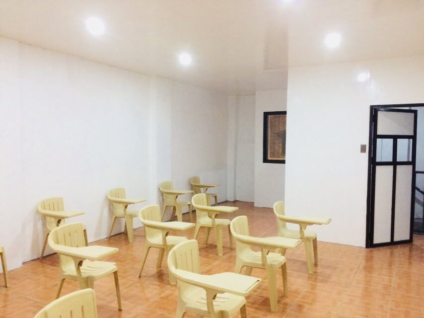 Classroom with armchairs arranged for a small class