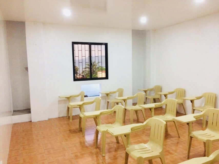 Bright classroom with windows along one wall
