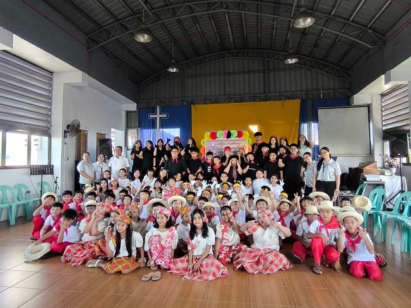 Pupils in Filipiniana costume on the worship hall stage